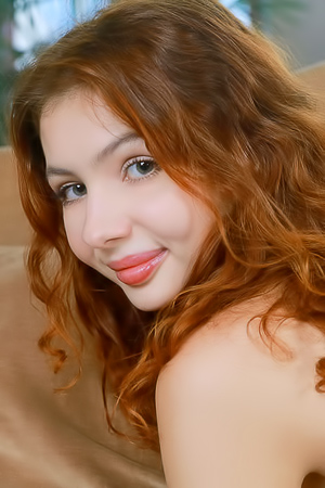 Bella Beatrice Lounging On The Soft Cushions With Her Long Legs Spread Wide